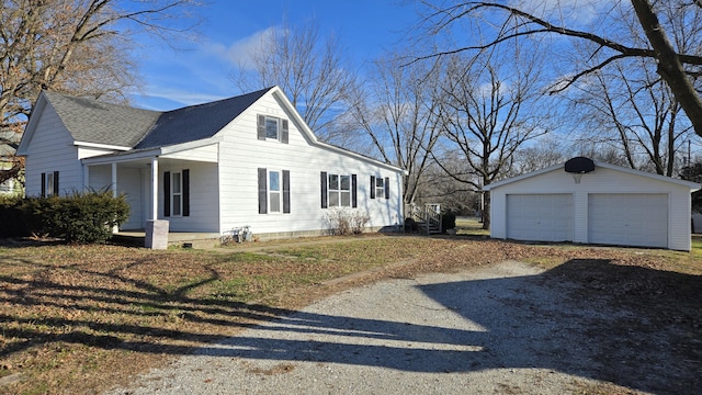 view of property exterior with an outdoor structure and a garage