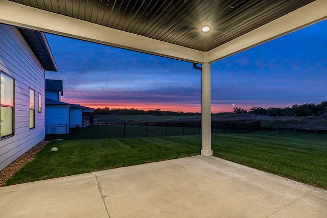 patio terrace at dusk with a lawn