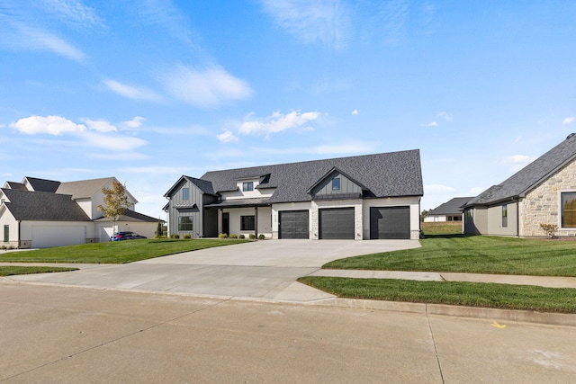 view of front of property with a front lawn and a garage