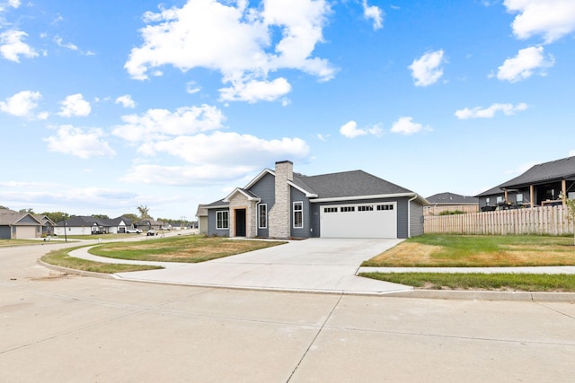 view of front facade featuring a front lawn and a garage