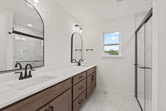 bathroom featuring vanity and an enclosed shower