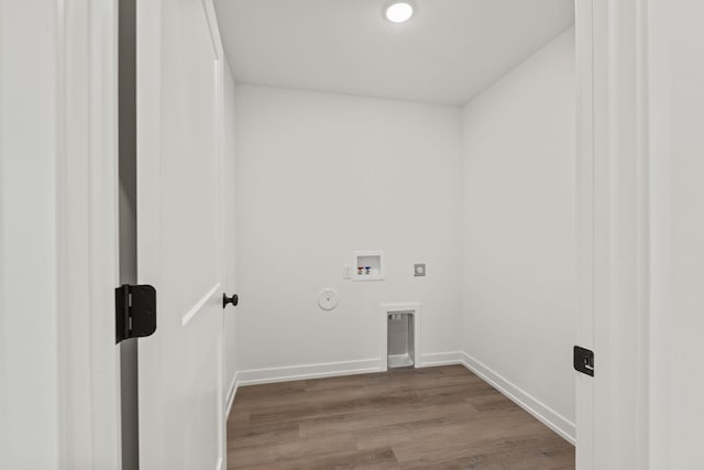 washroom with hookup for an electric dryer, hookup for a washing machine, gas dryer hookup, and wood-type flooring