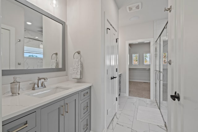 bathroom with vanity and an enclosed shower