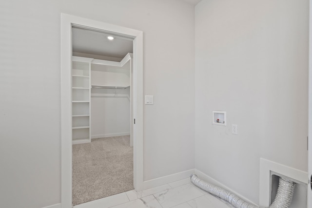 washroom featuring hookup for a washing machine and light colored carpet