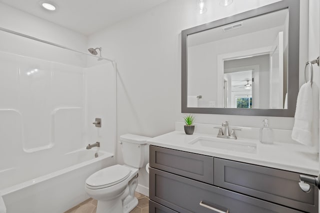 full bathroom featuring toilet, shower / tub combination, vanity, and tile patterned floors