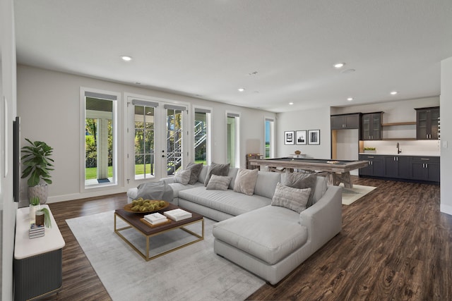 living room with french doors, billiards, dark wood-type flooring, and sink