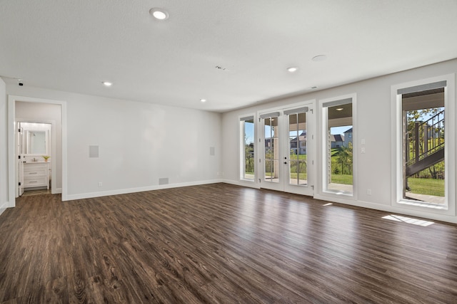 spare room with dark hardwood / wood-style flooring