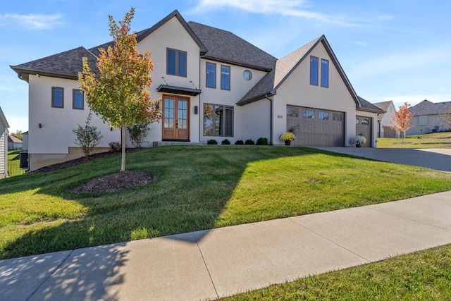 view of front of house with a front lawn and a garage