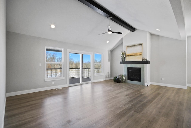 unfurnished living room with ceiling fan, dark hardwood / wood-style flooring, and lofted ceiling with beams