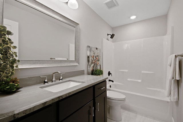 full bathroom with vanity, toilet, and bathtub / shower combination