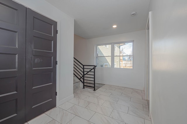 interior space with recessed lighting, marble finish floor, stairs, and baseboards