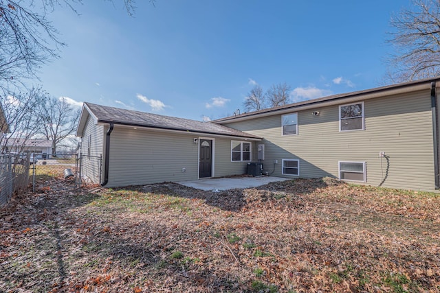 back of house featuring a patio, a gate, central AC unit, and fence