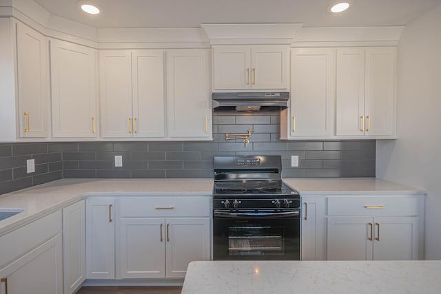 kitchen with black / electric stove, light stone countertops, decorative backsplash, white cabinets, and under cabinet range hood