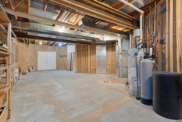 unfinished basement featuring water heater