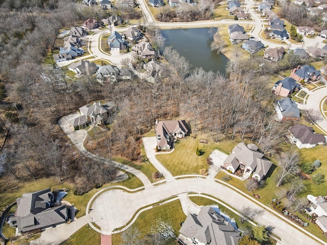 drone / aerial view featuring a water view and a residential view