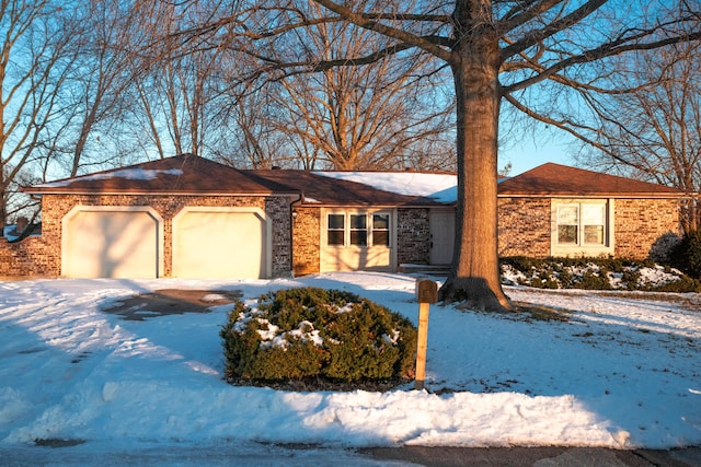 single story home featuring a garage