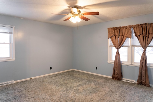 empty room with carpet floors and ceiling fan