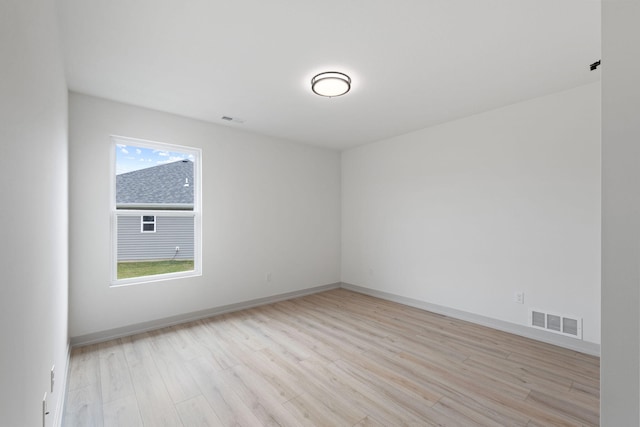 unfurnished room featuring plenty of natural light and light hardwood / wood-style flooring