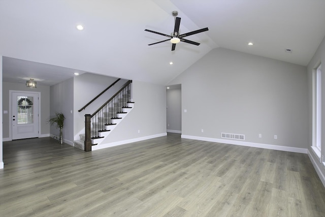 unfurnished living room featuring high vaulted ceiling, light hardwood / wood-style flooring, and ceiling fan