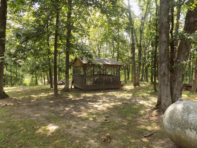 view of yard with a wooden deck