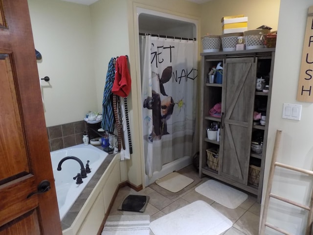 bathroom with tile patterned floors and independent shower and bath