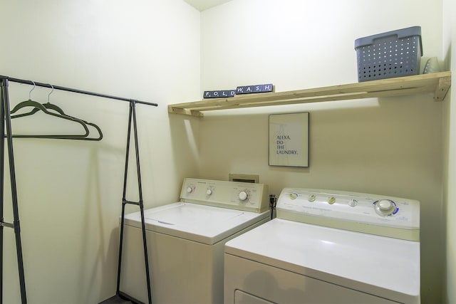 clothes washing area with independent washer and dryer