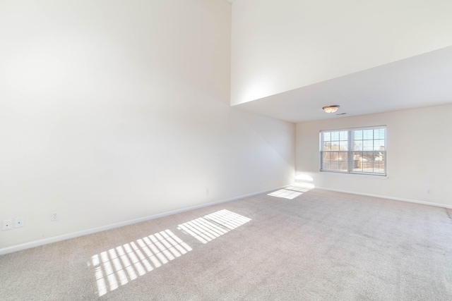 empty room with light colored carpet