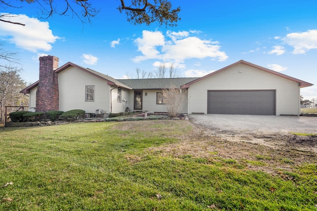 ranch-style home featuring a garage and a front lawn