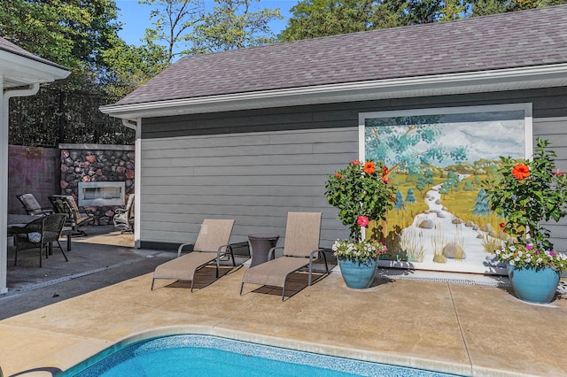 view of swimming pool featuring a patio area