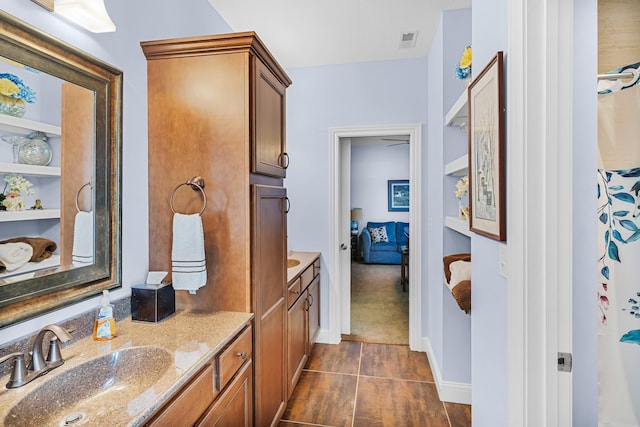 bathroom with tile patterned floors and vanity