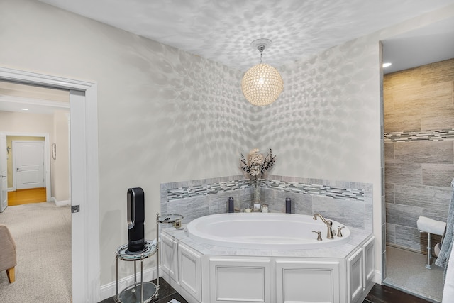 bathroom with a tub to relax in