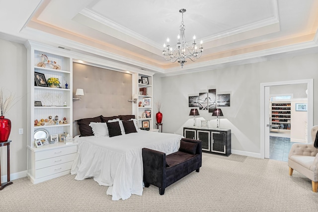 bedroom with a chandelier, crown molding, light carpet, and a tray ceiling