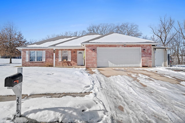 ranch-style house featuring a garage