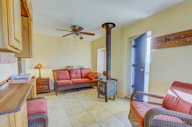 tiled living room featuring ceiling fan