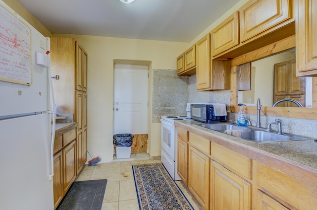 kitchen featuring light brown cabinetry, backsplash, white appliances, sink, and light tile patterned floors