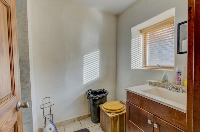 bathroom with tile patterned floors and vanity