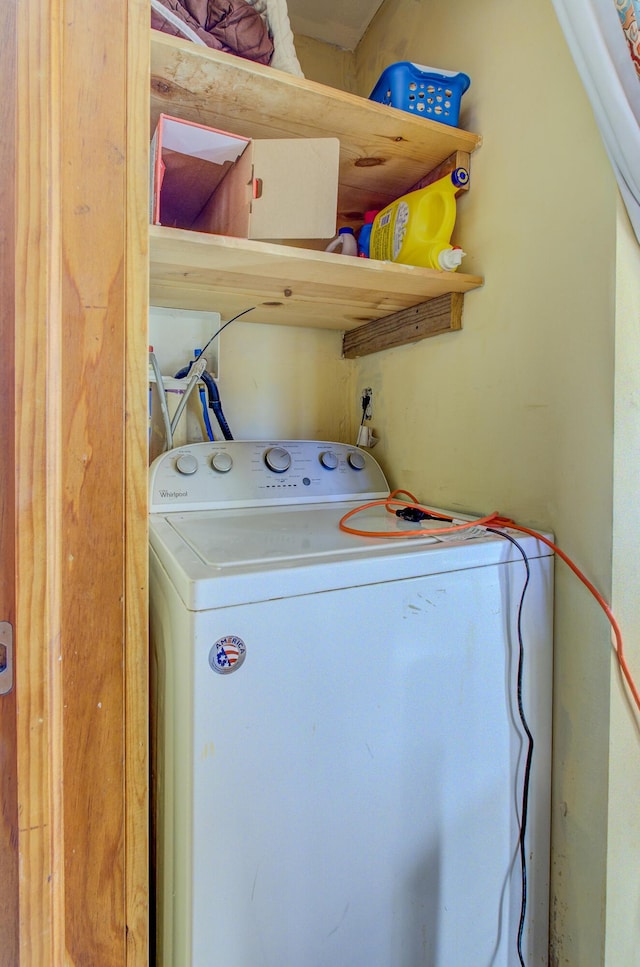 clothes washing area featuring washer / dryer