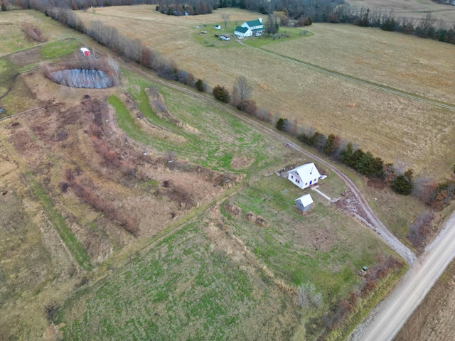 birds eye view of property featuring a rural view