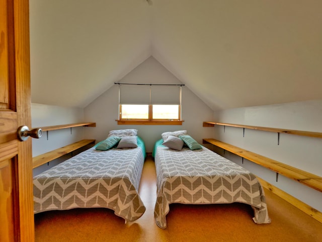 bedroom featuring lofted ceiling