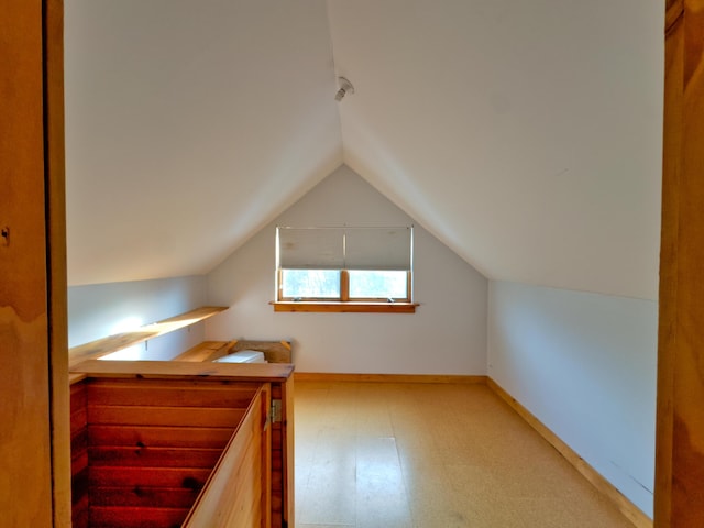 bonus room with vaulted ceiling