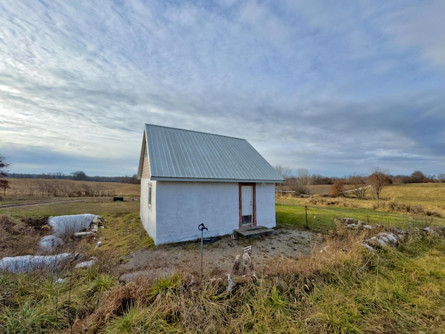 view of outbuilding with a rural view