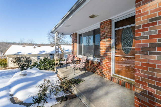 view of snow covered patio