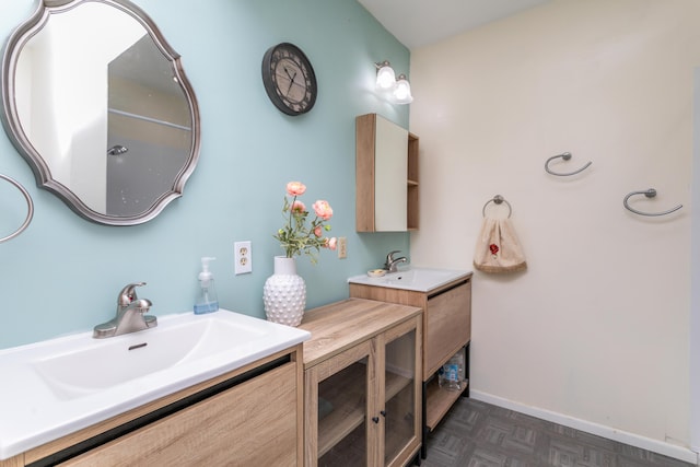 bathroom featuring vanity and parquet flooring