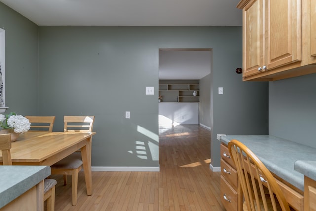 dining area featuring light wood-type flooring