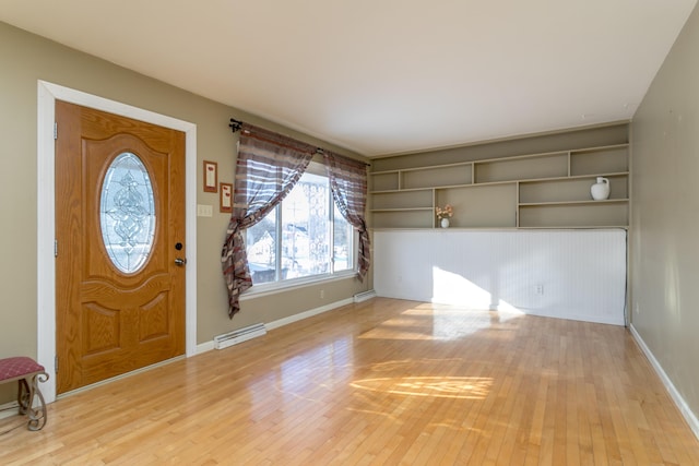 entrance foyer featuring light hardwood / wood-style floors and baseboard heating