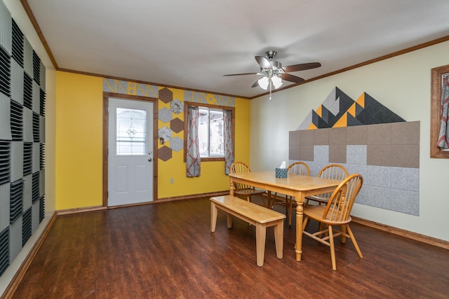 dining area with dark hardwood / wood-style floors, ceiling fan, and ornamental molding