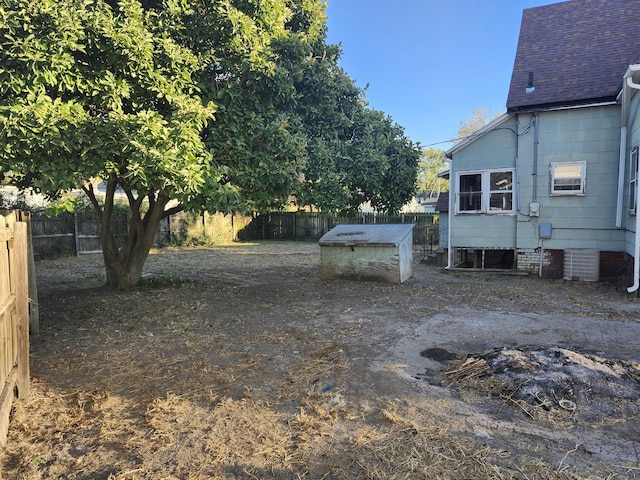 view of yard with central air condition unit