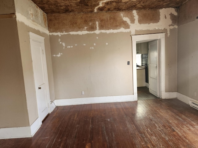 spare room featuring dark hardwood / wood-style flooring