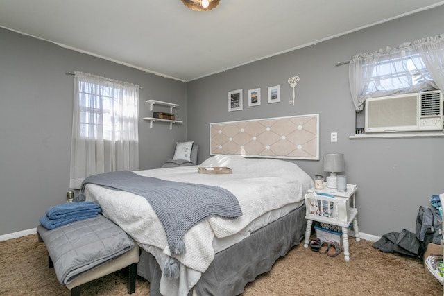 carpeted bedroom featuring baseboards