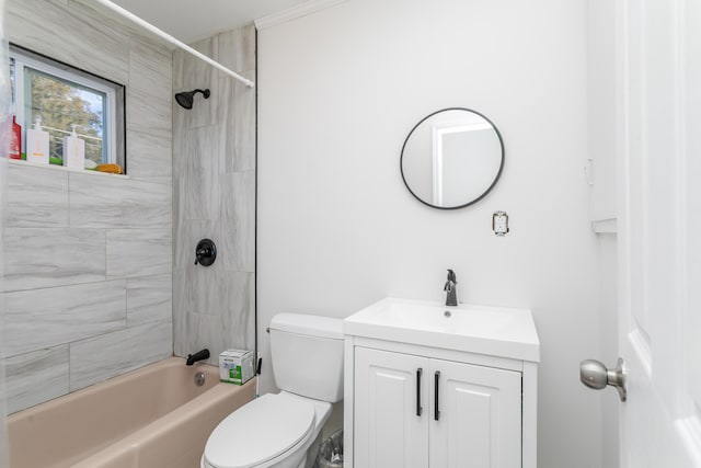 bathroom featuring toilet, shower / bathtub combination, and vanity